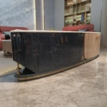 Two-Tone Curved TV Stand with White Marble Top and High-Gloss Wood Panels